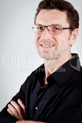 attractive adult man with glasses and black shirt