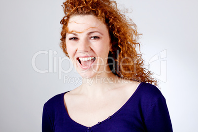 attractive young redhead woman smiling portrait