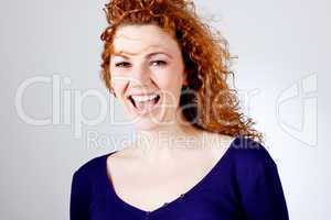 attractive young redhead woman smiling portrait