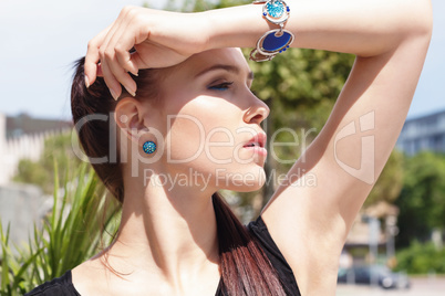 attractive brunette young woman in summer outdoor