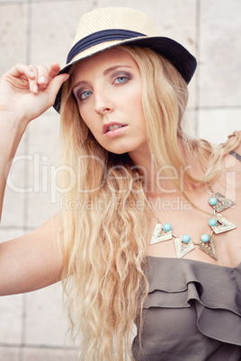 happy young blonde woman with hat outdoor summertime