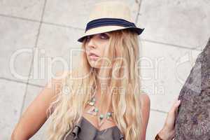 happy young blonde woman with hat outdoor summertime