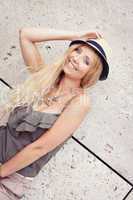 happy young blonde woman with hat outdoor summertime