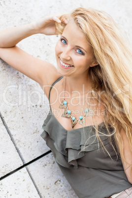 happy young blonde woman with hat outdoor summertime