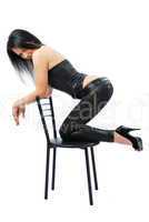 Sexy woman kneeling on the chair