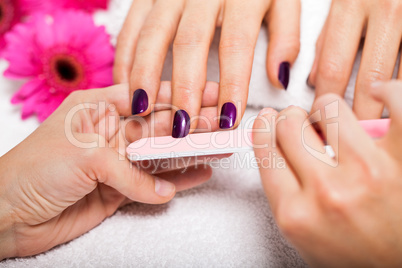 manicure making in beauty spa salon