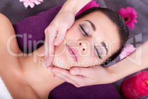 Woman having a relaxing facial massage