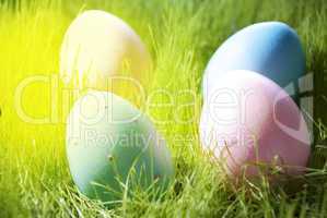 Four Decorative Easter Eggs On Sunny Green Grass