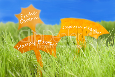 Three Labels With Happy Easter In Different Languages And Blue Sky