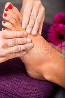 Woman having a pedicure treatment at a spa