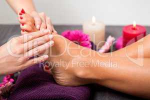 Woman having a pedicure treatment at a spa