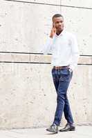 young successfil african businessman with mobilephone