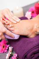 Woman having a pedicure treatment at a spa