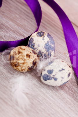 easter decoration with quail eggs on wood