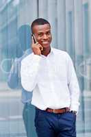 young successfil african businessman with mobilephone