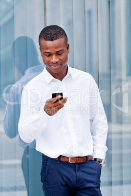 young successfil african businessman with mobilephone