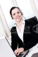 smiling young female callcenter agent with headset