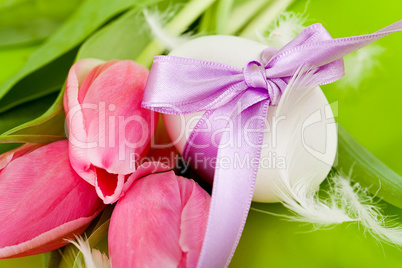 traditional easter egg decoration with tulips and ribbon