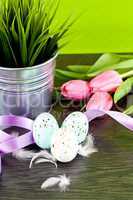 traditional easter egg decoration with tulips and ribbo
