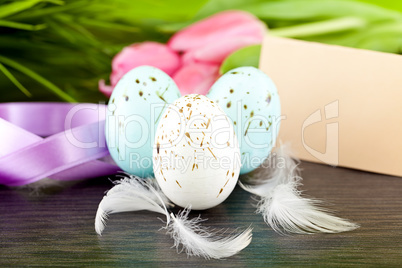 traditional easter egg decoration with tulips and ribbo