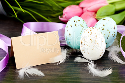 traditional easter egg decoration with tulips and ribbo