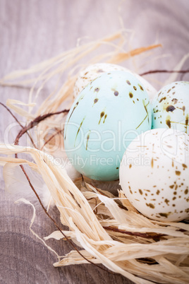 Three natural blue Easter eggs in a basket