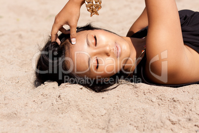 beautiful asian woman with colorful makeup on the beach