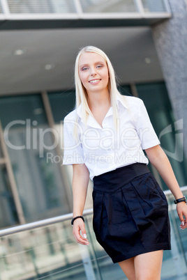 attractive young successful smiling business woman standing outdoor