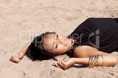 beautiful asian woman with colorful makeup on the beach