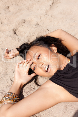 beautiful asian woman with colorful makeup on the beach