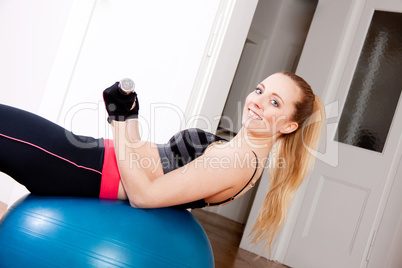 attractive young woman doing fitness dumbbell