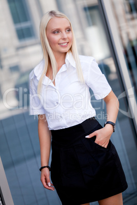 attractive young successful smiling business woman standing outdoor