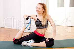 attractive young woman doing workout stretching