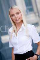 attractive young successful smiling business woman standing outdoor