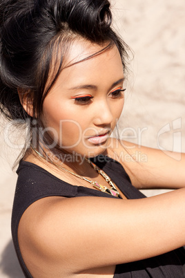 beautiful asian woman with colorful makeup on the beach