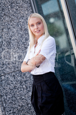 attractive young successful smiling business woman standing outdoor