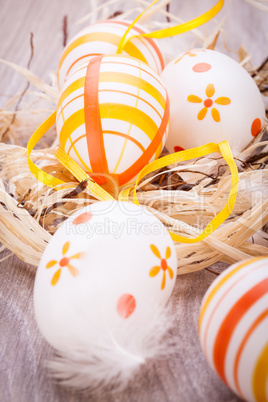 Decorative Easter eggs, on a rustic wooden table