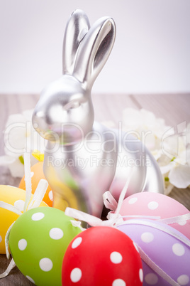 Easter still life with a silver bunny and eggs