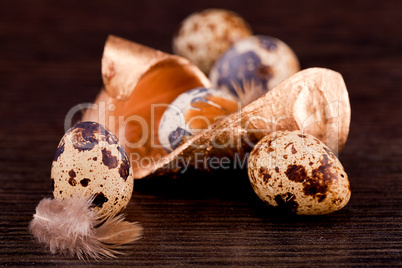 easter decoration with quail eggs on wood