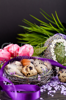 pink tulips and brown eggs with purple ribbon easter decoration