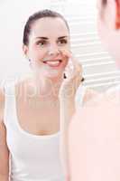 apllying cream on face skincare