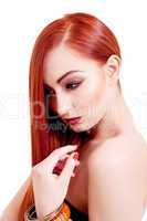 attractive young woman with shiny red hair and makeup
