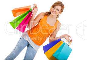 attractive young woman with colorful shopping bags