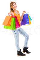 attractive young woman with colorful shopping bags