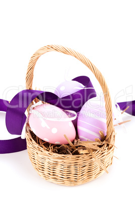 Straw basket with traditional Easter eggs