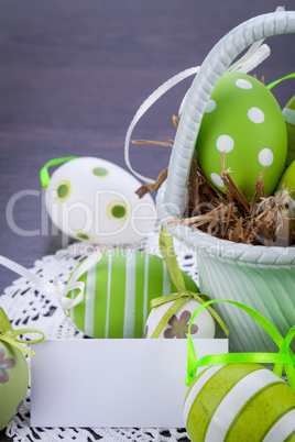 Colourful green Easter eggs in straw