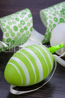 Colourful green Easter eggs in straw