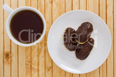 Cup of tea and mini eclairs