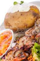 Grilled prawns with endive salad and jacket potato