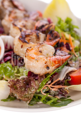 Grilled prawns with endive salad and jacket potato